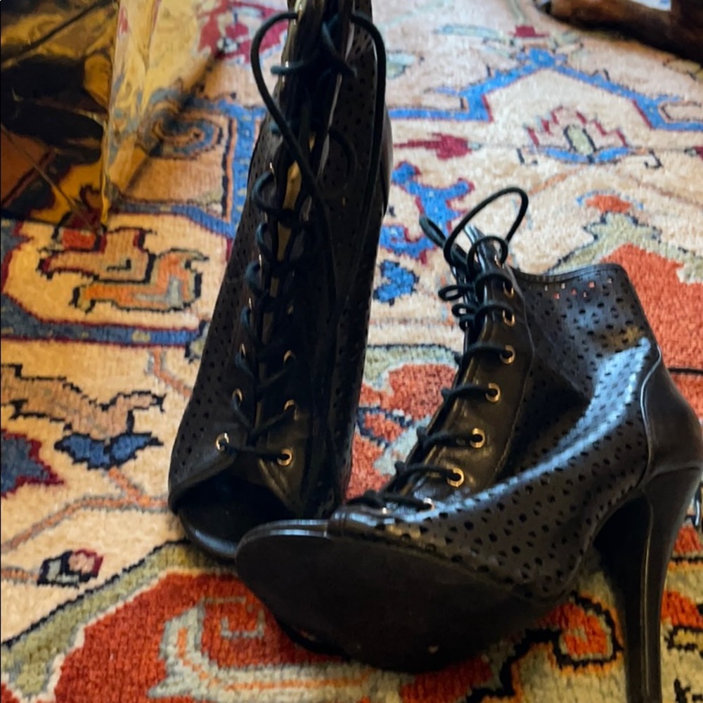 Lace up perforated high heeled booties